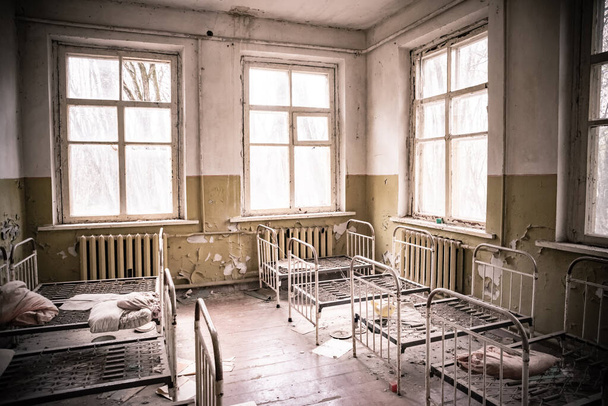 Bedroom in abandoned kindergarten Cherrnobyl zone, Ukraine - Foto, Imagen