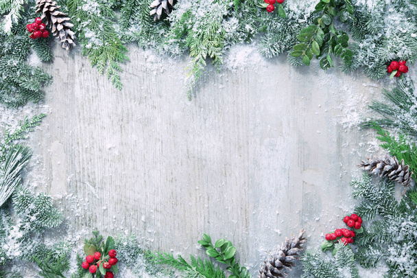 Christmas and New Year background with fir branches and snowfall - Photo, image
