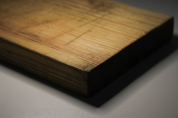 Old wooden board on a gray background - Photo, Image