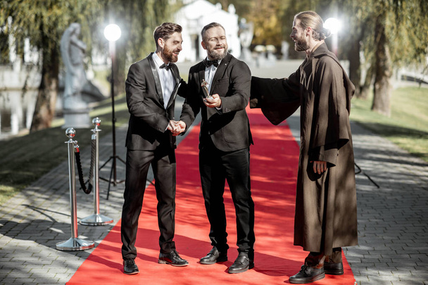 Film actors on the red carpet outdoors - Photo, Image