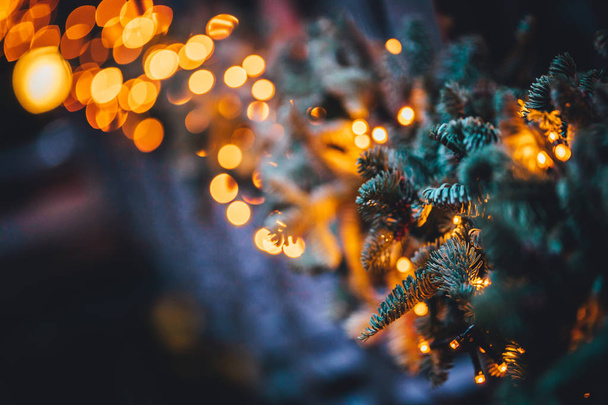 Close up view on Christmas tree lights and decorations, holiday season background. - Photo, Image