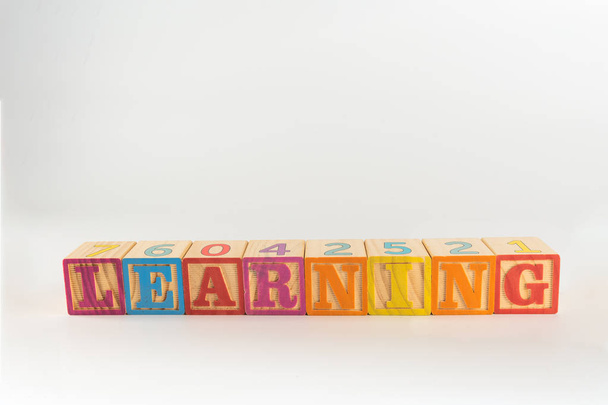 A child's alphabet toy spelling word block set, spelling out the word learning - Foto, immagini