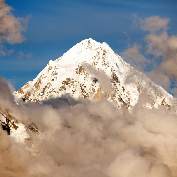 Evening view of Mount Salkantay in the middle of clouds - Photo, Image