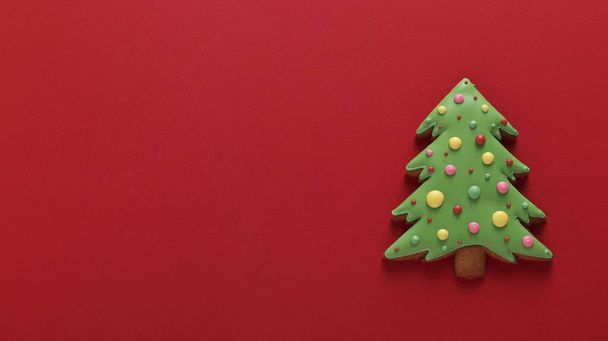 Edible Christmas tree, gingerbread, Happy New Year, red background, Copy space - Photo, Image