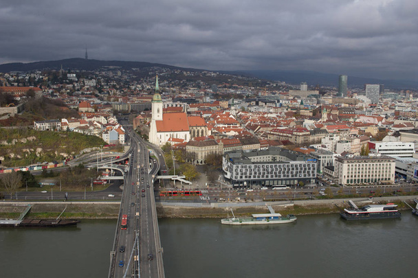 Bratislava, Slovakia - November 18, 2019: View from SNP bridge to the Bratislava Old Town  - Fotoğraf, Görsel