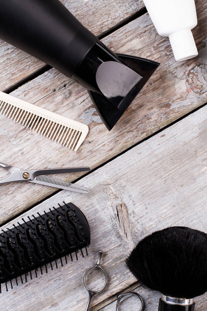 Hairdresser tools on vintage wooden background. - Fotografie, Obrázek