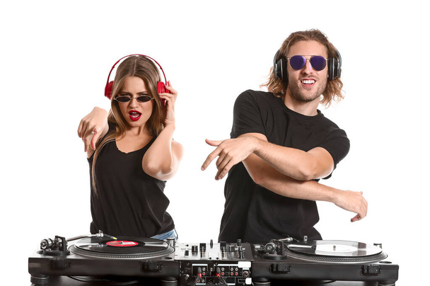 Young djs playing music on white background - Photo, image