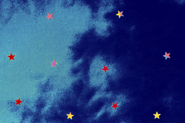 estrela em um fundo de tecido azul
 - Foto, Imagem