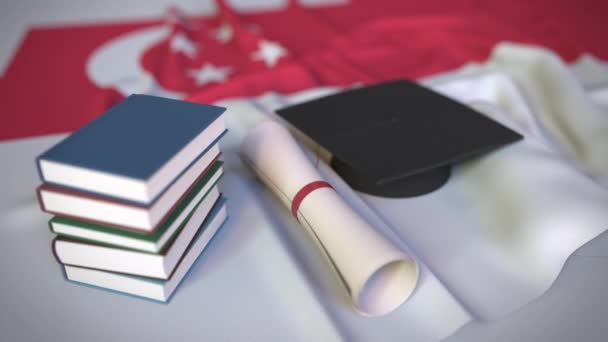 Afstuderen cap, boeken en diploma op de Singaporese vlag. Hoger onderwijs in Singapore gerelateerde conceptuele 3d animatie - Video