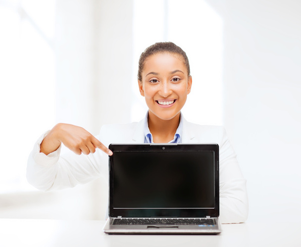 Smiling woman with laptop computer - Фото, изображение