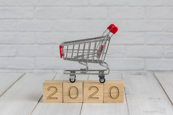 trolley on 2020 new year block ,  shopping concept - Foto, Imagem