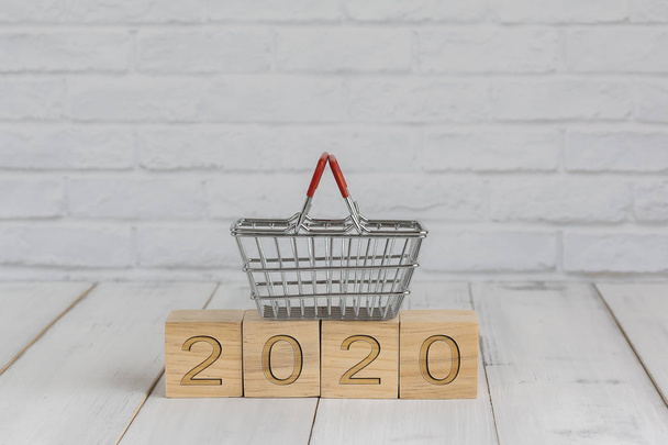 basket on 2020 new year block ,  shopping concept - Foto, afbeelding