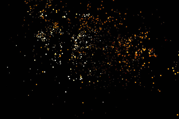 Golden sparkles on black background - Fotoğraf, Görsel