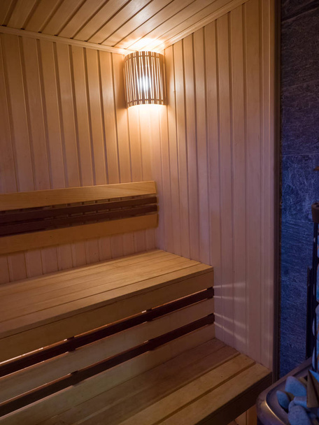 New wooden sauna. Angled view. Traditional interior decoration - Foto, afbeelding
