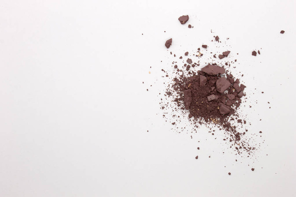 This is a photograph of a Matte Light Mahogany Powder Eyeshadow isolated on a White Background  - Photo, image