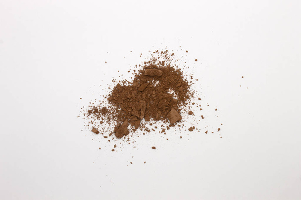 This is a photograph of a Matte Brown Powder Eyeshadow isolated on a White Background  - Photo, Image