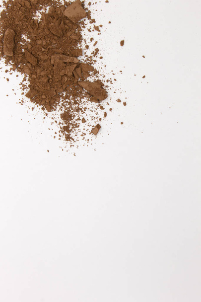 This is a photograph of a Matte Brown Powder Eyeshadow isolated on a White Background  - Photo, image