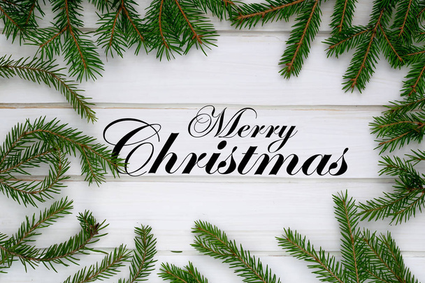 Merry Christmas background, green fir branches, white boards - Foto, Bild