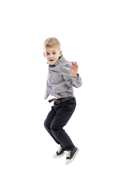 Jumping  boy of preschool age. Sport and activity. Isolated over white background.  - Fotografie, Obrázek