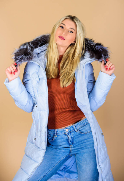 Feeling cozy. woman in padded warm coat. flu and cold. seasonal fashion. happy winter holidays. beauty in winter clothing. cold season shopping. girl in puffed coat. faux fur fashion - Photo, image