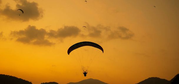 Silhouette parachutists  - Photo, Image