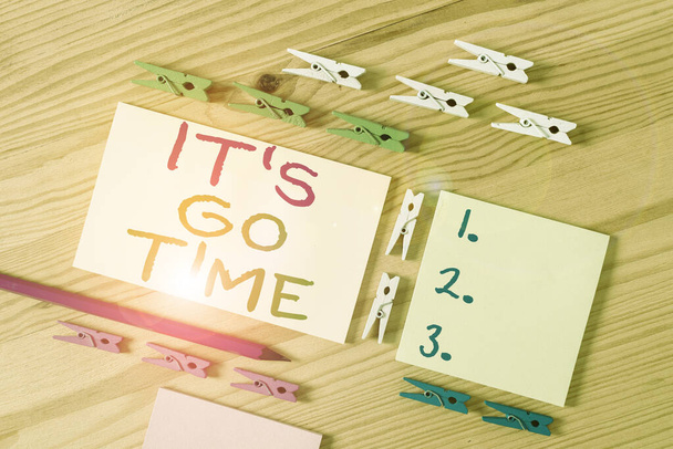Text sign showing It S Go Time. Conceptual photo A period to undertake the assigned tasks Bring it ON Colored clothespin papers empty reminder wooden floor background office. - Photo, Image