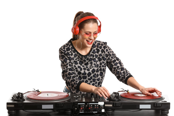 Female dj playing music on white background - Foto, afbeelding