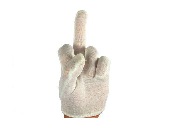 Środkowy palec w białej bawełnianej rękawiczce. Izolowane zbliżenie na - Zdjęcie, obraz