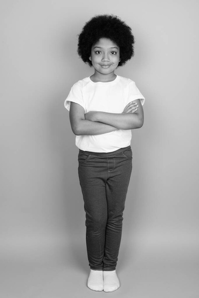 Young cute African girl with Afro hair in black and white - Photo, Image