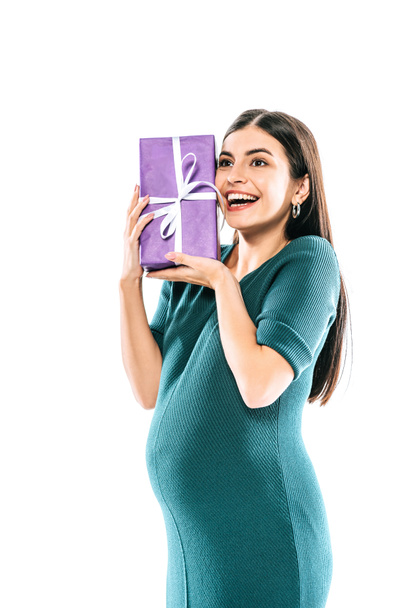 happy pregnant girl holding present isolated on white - 写真・画像