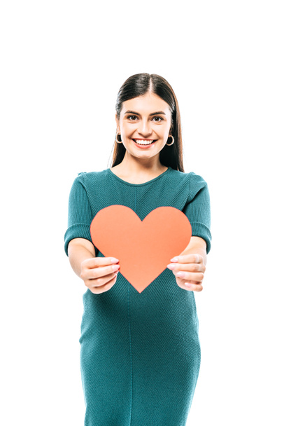 smiling pregnant girl holding paper heart isolated on white - Фото, зображення