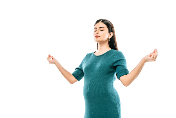 pregnant girl with closed eyes meditating isolated on white - Foto, afbeelding
