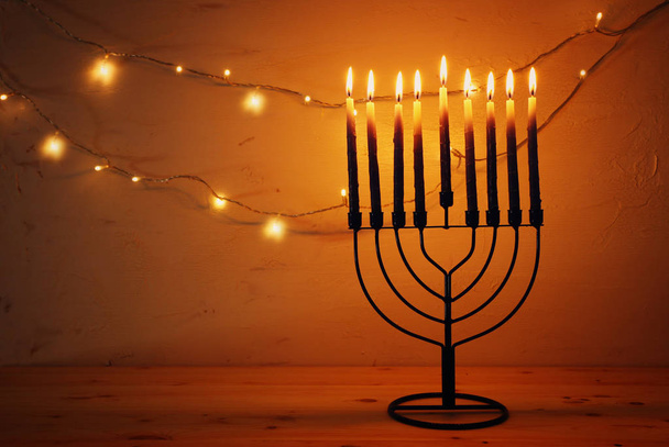 Religion image of jewish holiday Hanukkah background with menorah (traditional candelabra) and candles - Foto, Imagen
