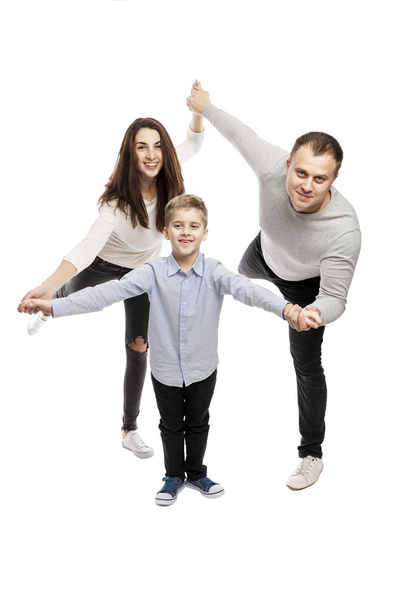 Happy family hugs and smiles while standing. Isolated over white background.  - Φωτογραφία, εικόνα