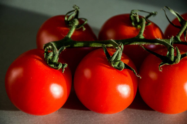 fresh tomatoes on black background - Zdjęcie, obraz