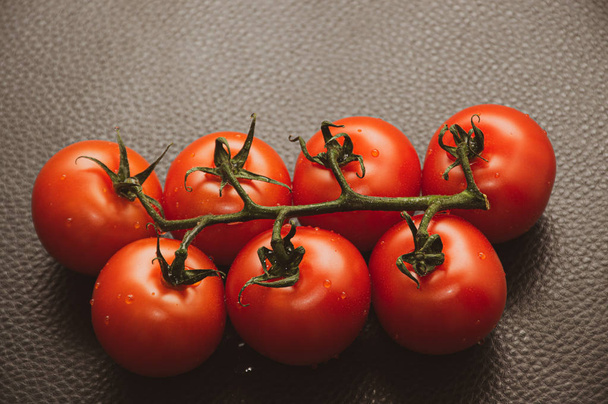 fresh tomatoes on black background - Foto, Imagen