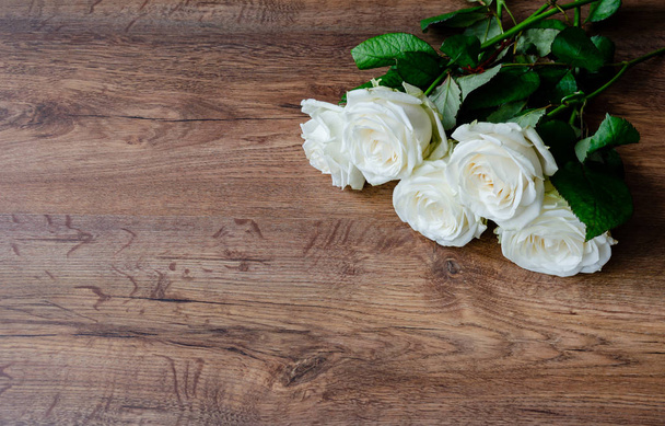 white rose flowers on a wooden background, vintage toned - Foto, Imagem
