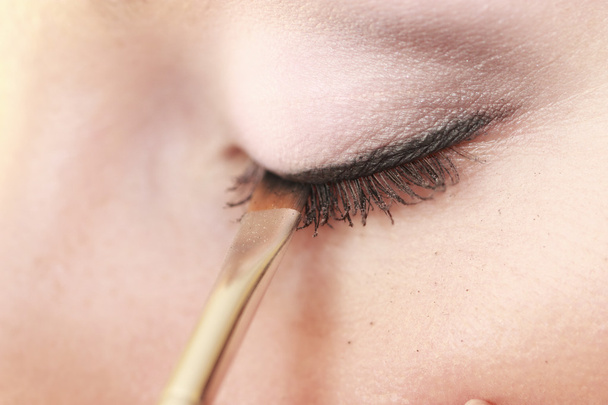 Part of face female eye makeup applying with brush - Fotoğraf, Görsel