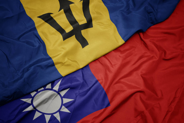 machanie barwną flagą Tajwanu i flagą narodową Barbadosu. - Zdjęcie, obraz