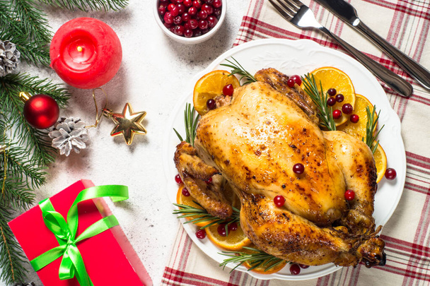 Chrismas chicken baked with cranberry, orange and rosemary. Christmas food. - Foto, afbeelding