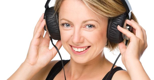 Young woman enjoying music using headphones - Zdjęcie, obraz