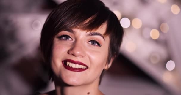 Beautiful smiling girl with short haircut and make up. - Video