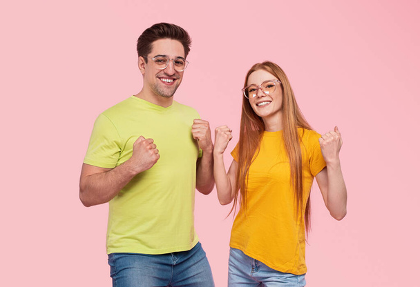 Cheerful young couple celebrating success - Foto, Imagen
