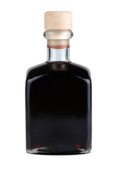 Homemade cherry liqueur in squared bottle  - Фото, изображение