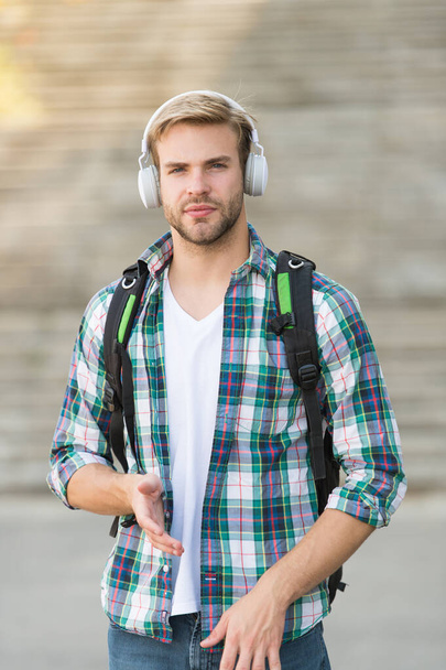 proper look. Audio book concept. Educational technology. student e learning. school life. Listen music. Modern and digital youth. stylish man. College student earphones smartphone. Online education - Fotó, kép