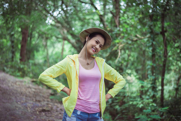 Portrait of young beautiful asian woman happy and smiling while lstanding at nature,Travel at outdoor - Photo, image
