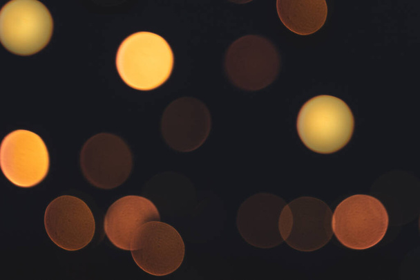 blurred colorful circle lights on the dark background, city light, abstract composition. - Photo, image