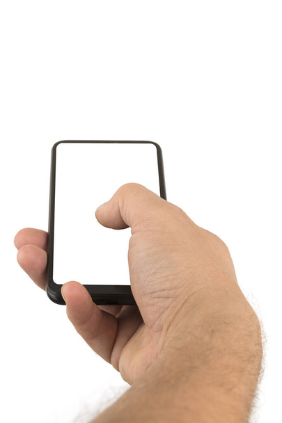 Mano masculina sosteniendo un smartphone con pantalla en blanco
. - Foto, imagen