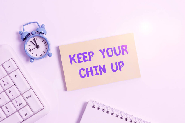 Conceptual hand writing showing Keep Your Chin Up. Business photo text Remain cheerful in difficult circumstances High Spirit Keyboard with empty note paper and pencil white background. - Fotoğraf, Görsel