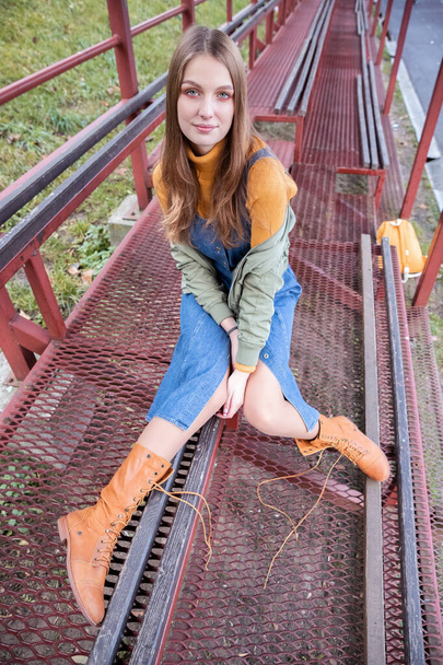 Modern Fashionable Teen Girl on the Football Field. Portrait. Autumn - Valokuva, kuva